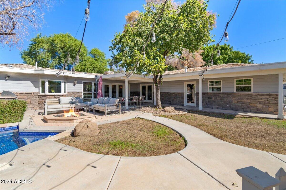 3841 East Elm Street Phoenix, AZ 85018 - Photo 49 of 72 a view of a house with backyard patio and swimming pool