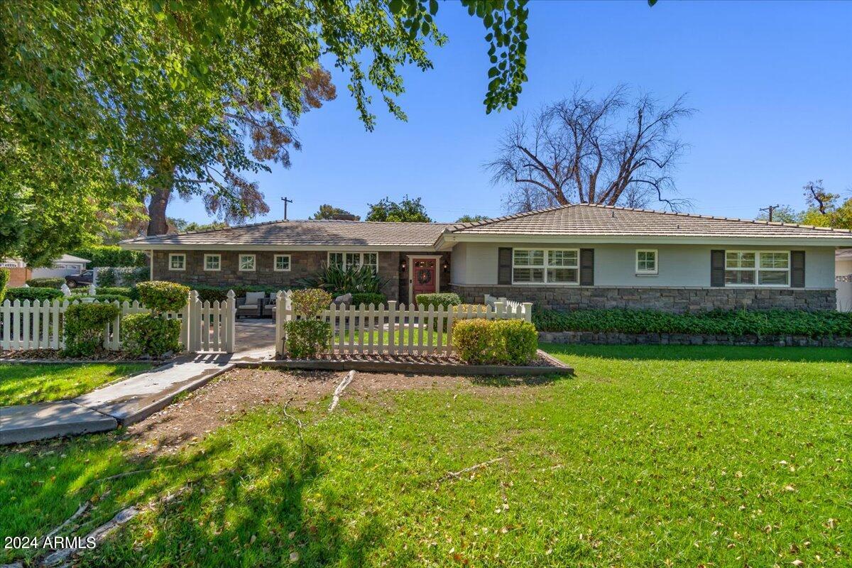 3841 East Elm Street Phoenix, AZ 85018 - Photo 5 of 72 a view of a house with a yard and deck
