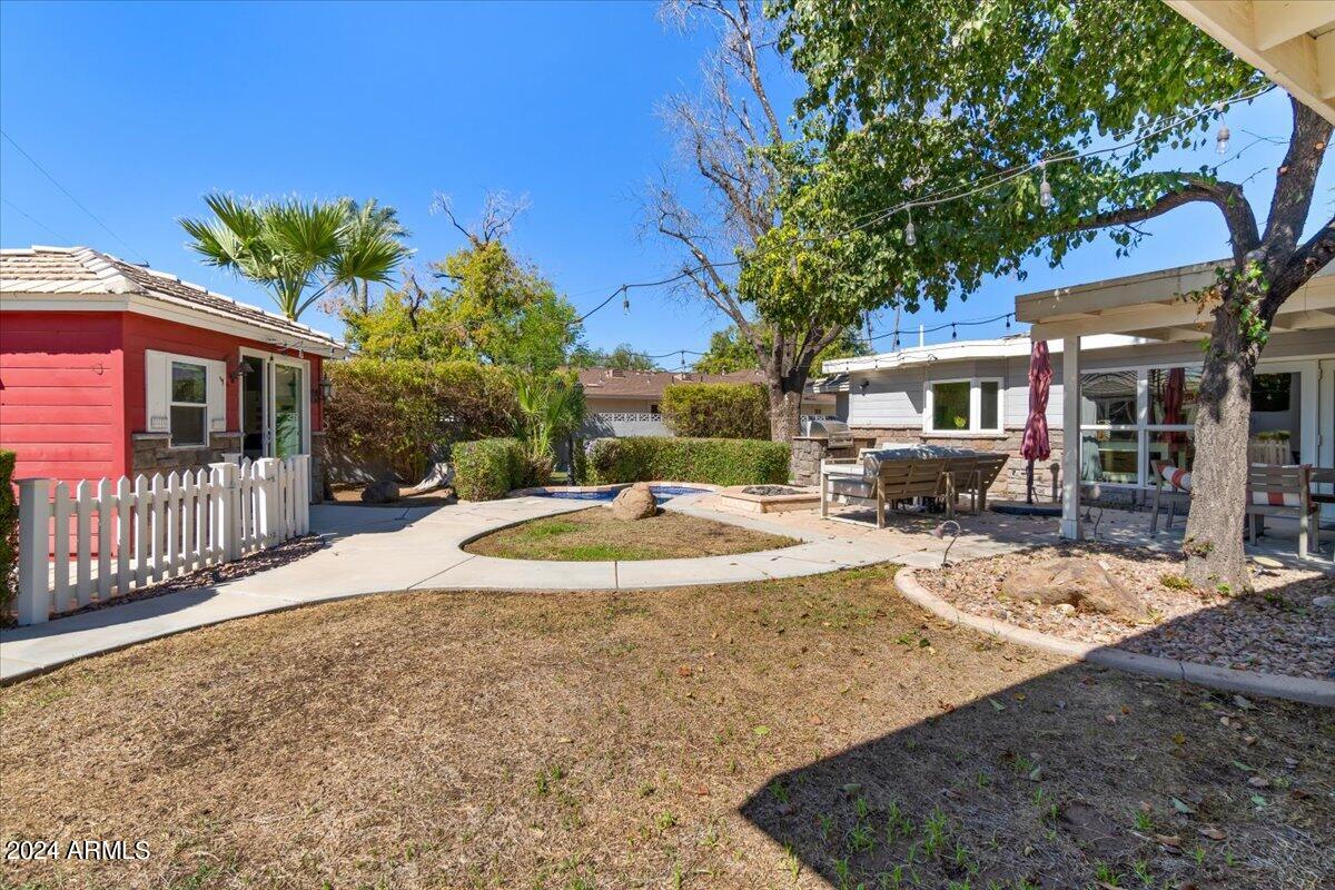 3841 East Elm Street Phoenix, AZ 85018 - Photo 51 of 72 a view of a house with a tree and a yard