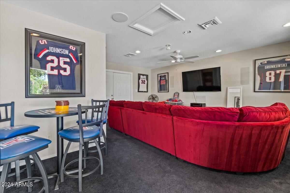 3841 East Elm Street Phoenix, AZ 85018 - Photo 53 of 72 a living room with furniture and a flat screen tv