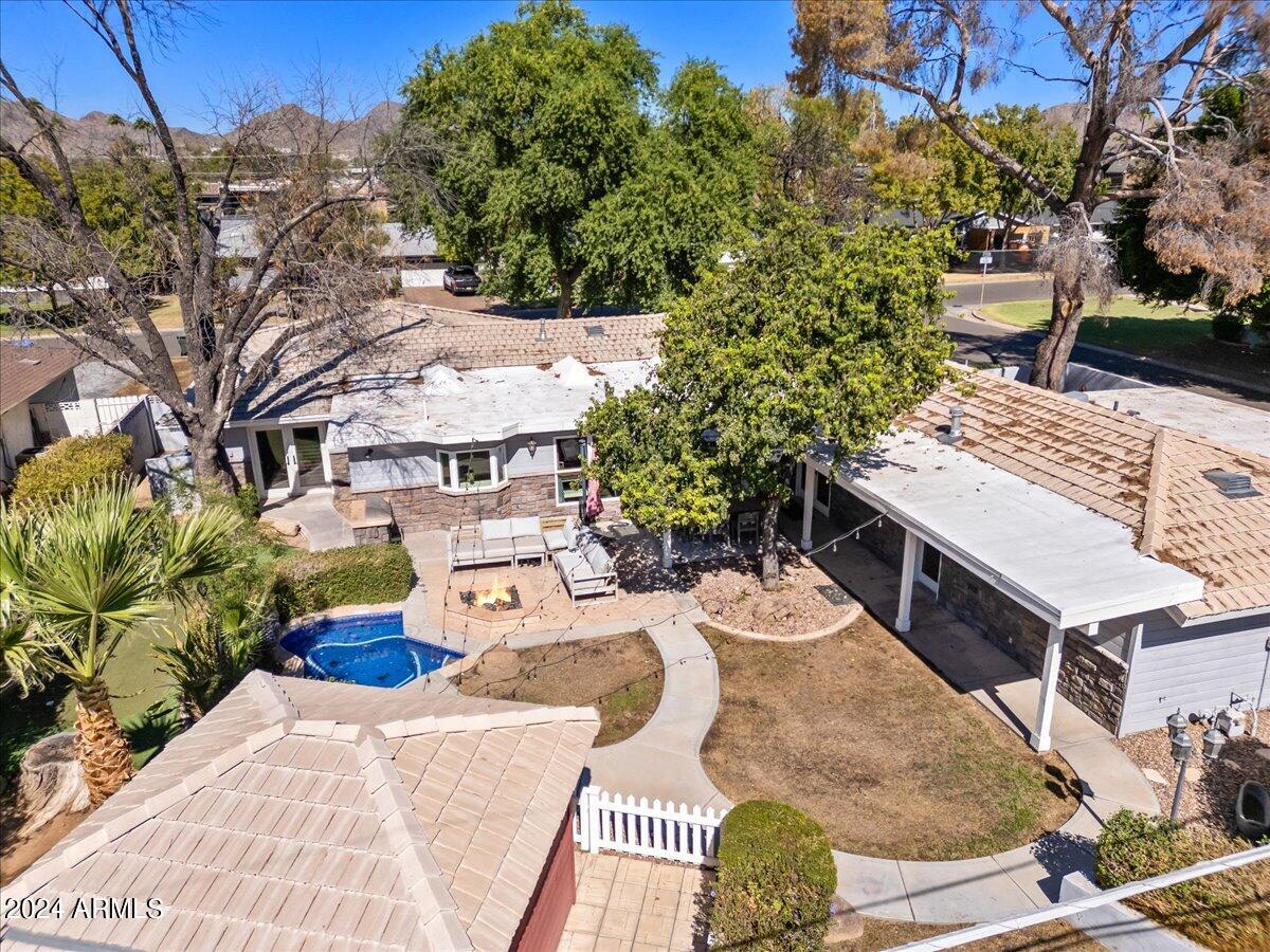 3841 East Elm Street Phoenix, AZ 85018 - Photo 66 of 72 a view of a patio with table and chairs with wooden floor and fence