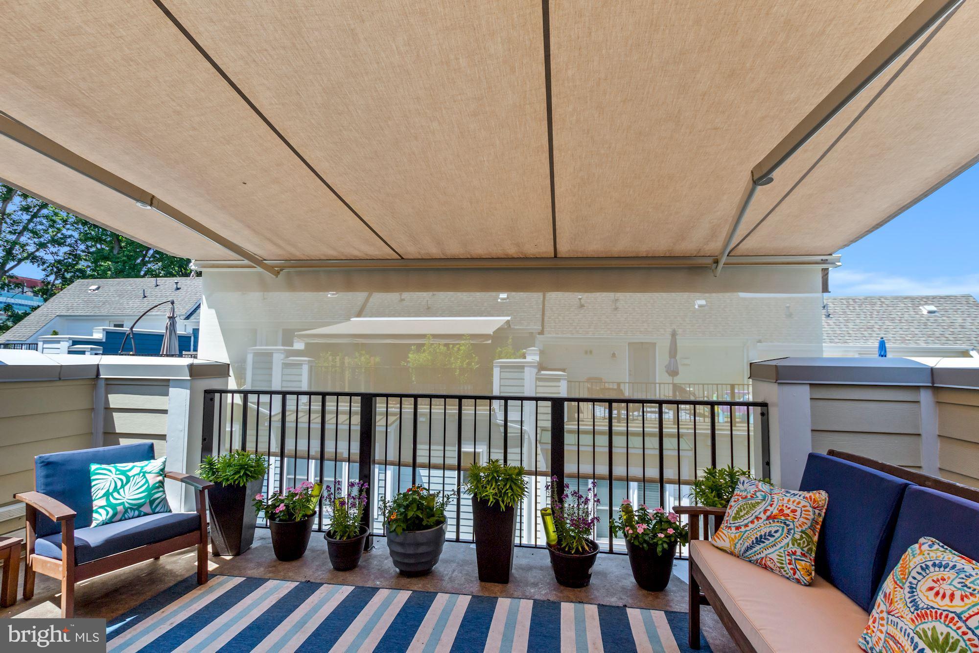 52 Ellsworth Heights Street Silver Spring, MD 20910 - Photo 29 of 41 Retractable awning w/ drop down privacy shade