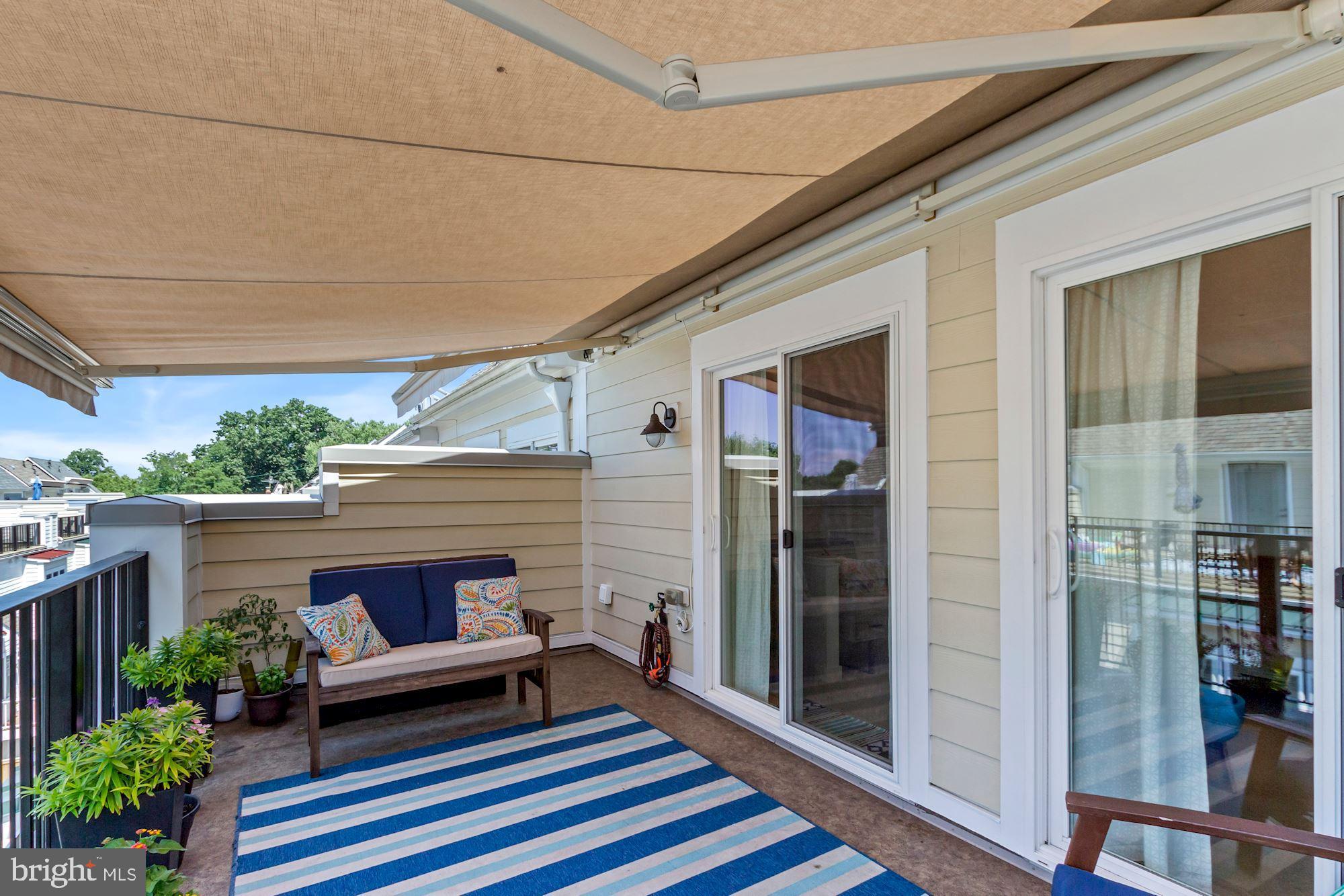 52 Ellsworth Heights Street Silver Spring, MD 20910 - Photo 30 of 41 Sunsetter retractable awning