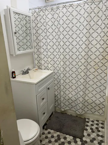 a bathroom with a sink and a toilet