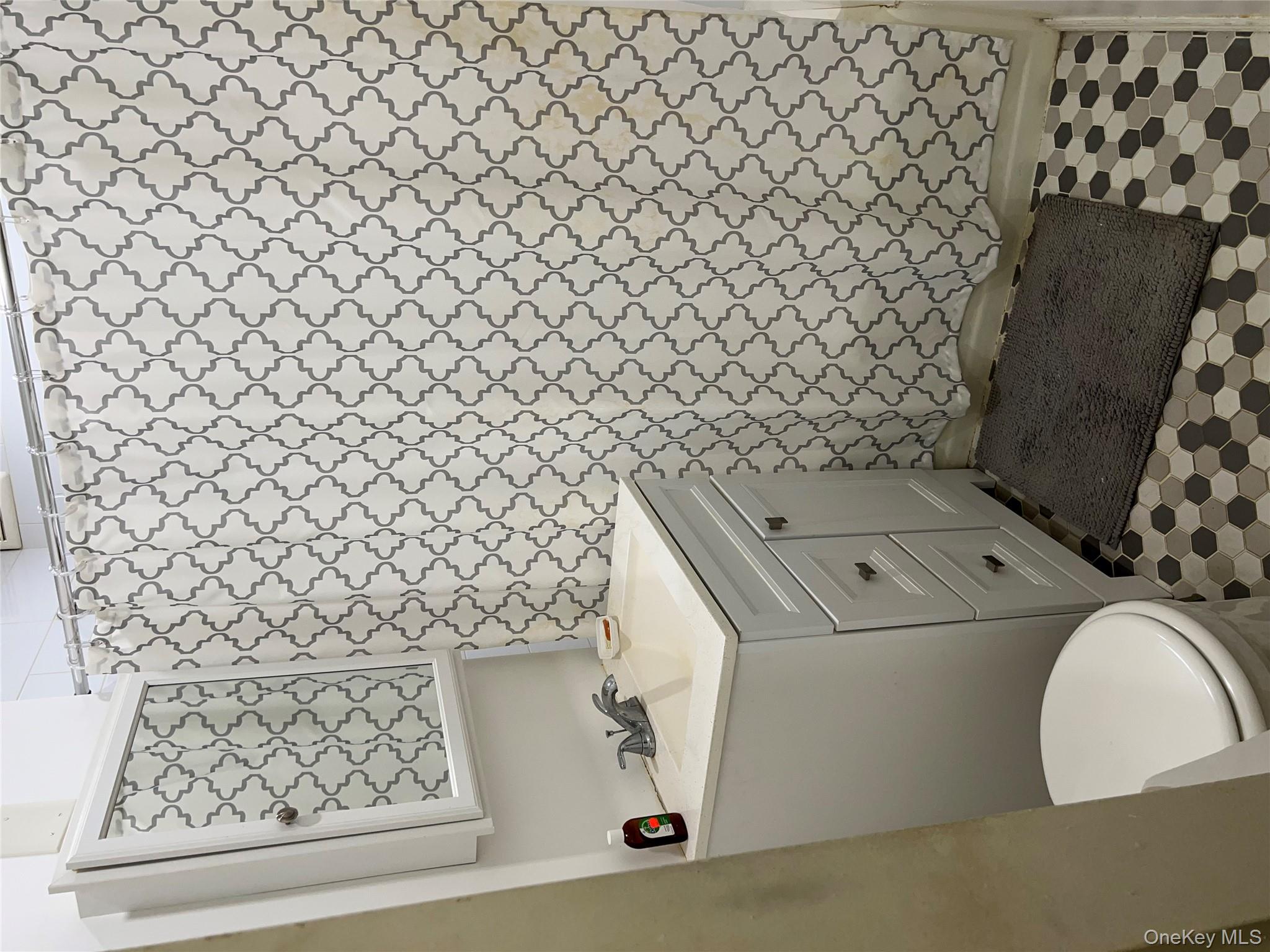 84-20 51st Avenue, Unit 6H Queens, NY 11373 - Photo 4 of 8 a bathroom with a sink and a toilet