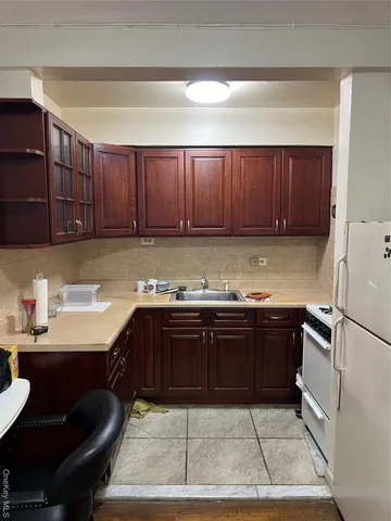 a kitchen with a sink and cabinets