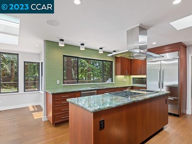 9 Redwood Circle Lafayette, CA 94549 - Photo 11 of 36 a kitchen with kitchen island granite countertop a stove and a sink