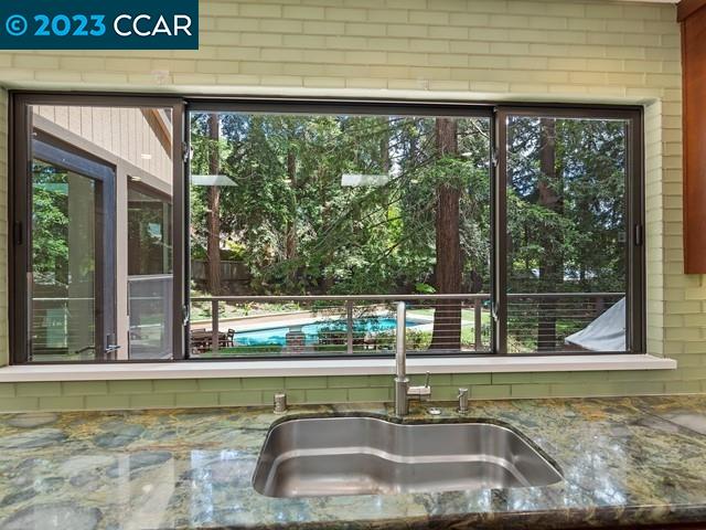 9 Redwood Circle Lafayette, CA 94549 - Photo 12 of 36 a view of a sink with a floor to ceiling window
