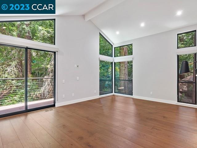 9 Redwood Circle Lafayette, CA 94549 - Photo 16 of 36 a view of an empty room with wooden floor and a window