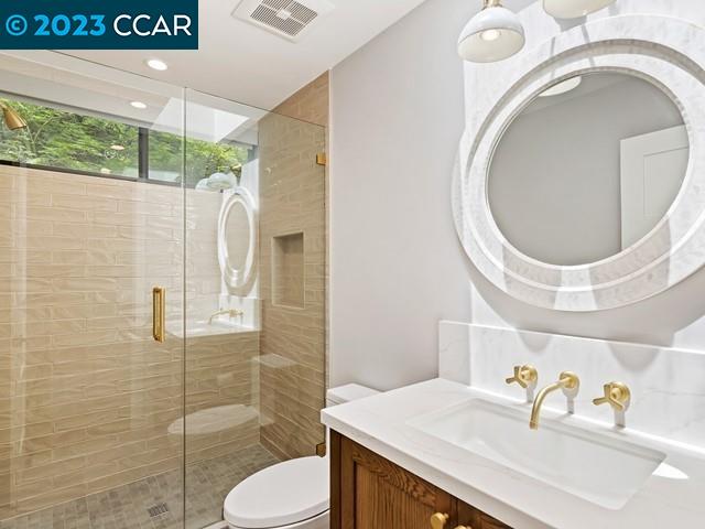 9 Redwood Circle Lafayette, CA 94549 - Photo 20 of 36 a bathroom with a sink a toilet and a mirror