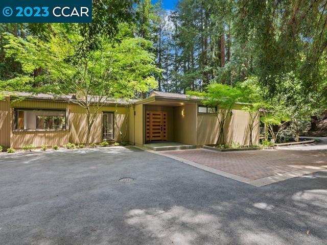 9 Redwood Circle Lafayette, CA 94549 - Photo 4 of 36 a front view of a house with a yard and garage