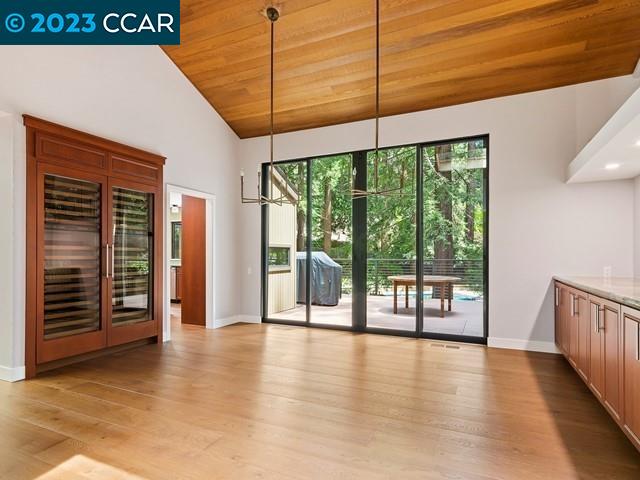 9 Redwood Circle Lafayette, CA 94549 - Photo 7 of 36 a view of an empty room with wooden floor and a window