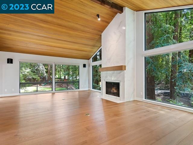 9 Redwood Circle Lafayette, CA 94549 - Photo 8 of 36 a view of an empty room with wooden floor and a window