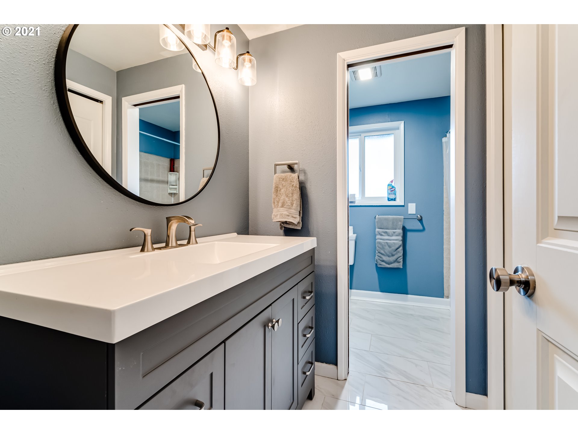 5609 C Street Springfield, OR 97478 - Photo 18 of 26 a bathroom with a sink vanity and a mirror