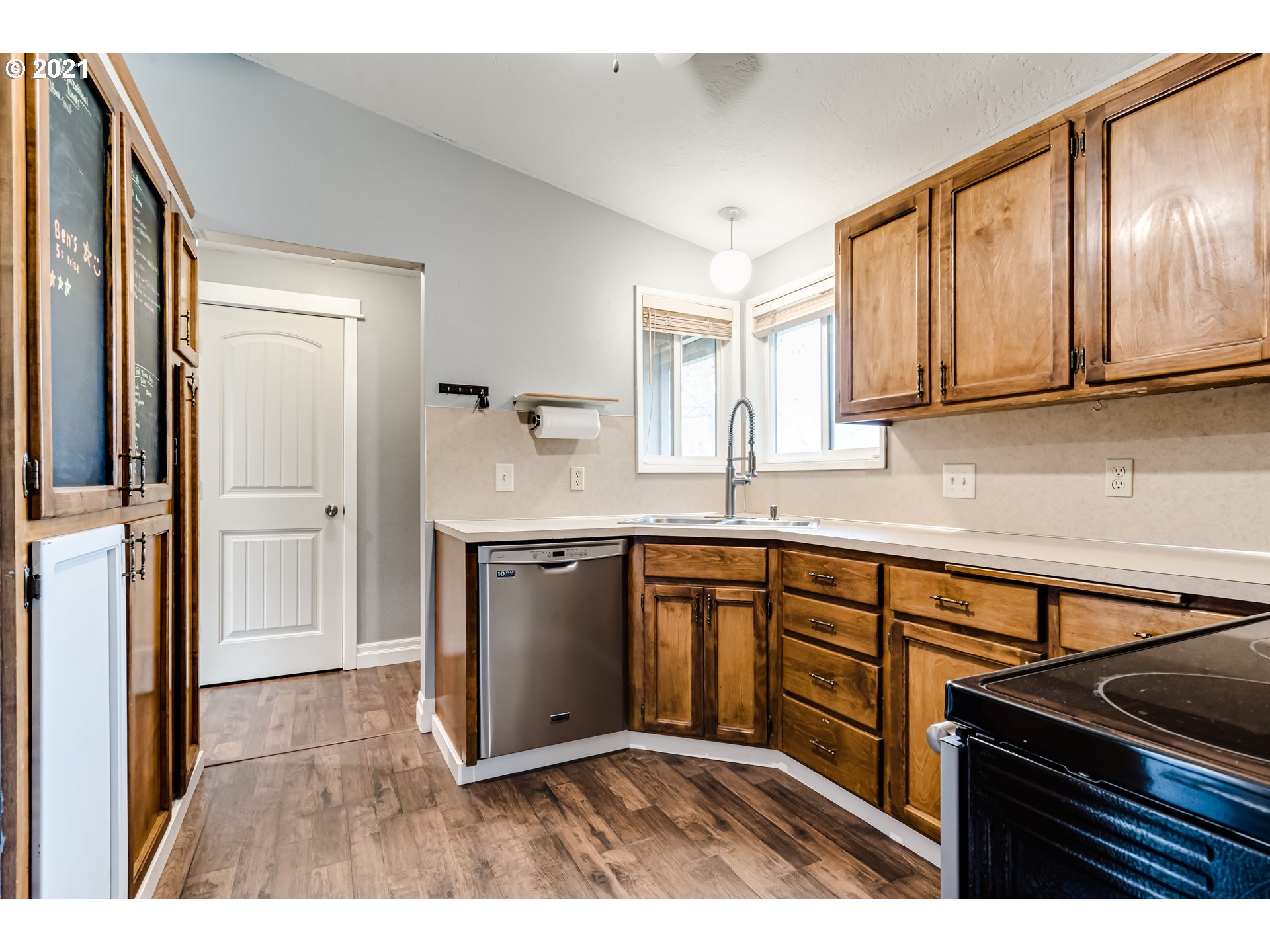 5609 C Street Springfield, OR 97478 - Photo 8 of 26 a kitchen with granite countertop a sink stove and refrigerator