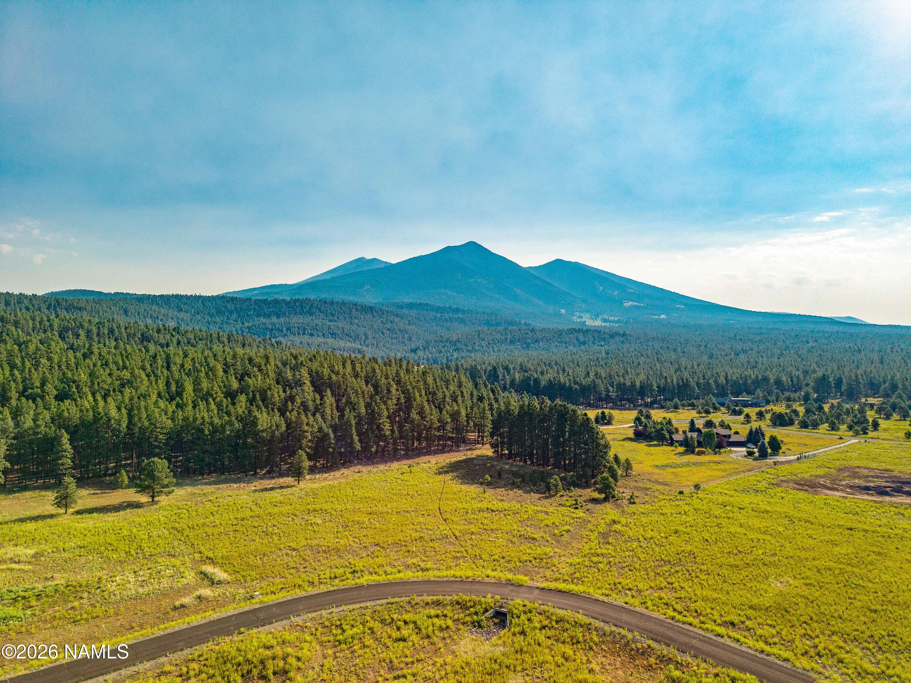 9217 Ranch At The Peaks Way Flagstaff, AZ 86001 - Photo 4 of 12 a view of a lake with a mountain
