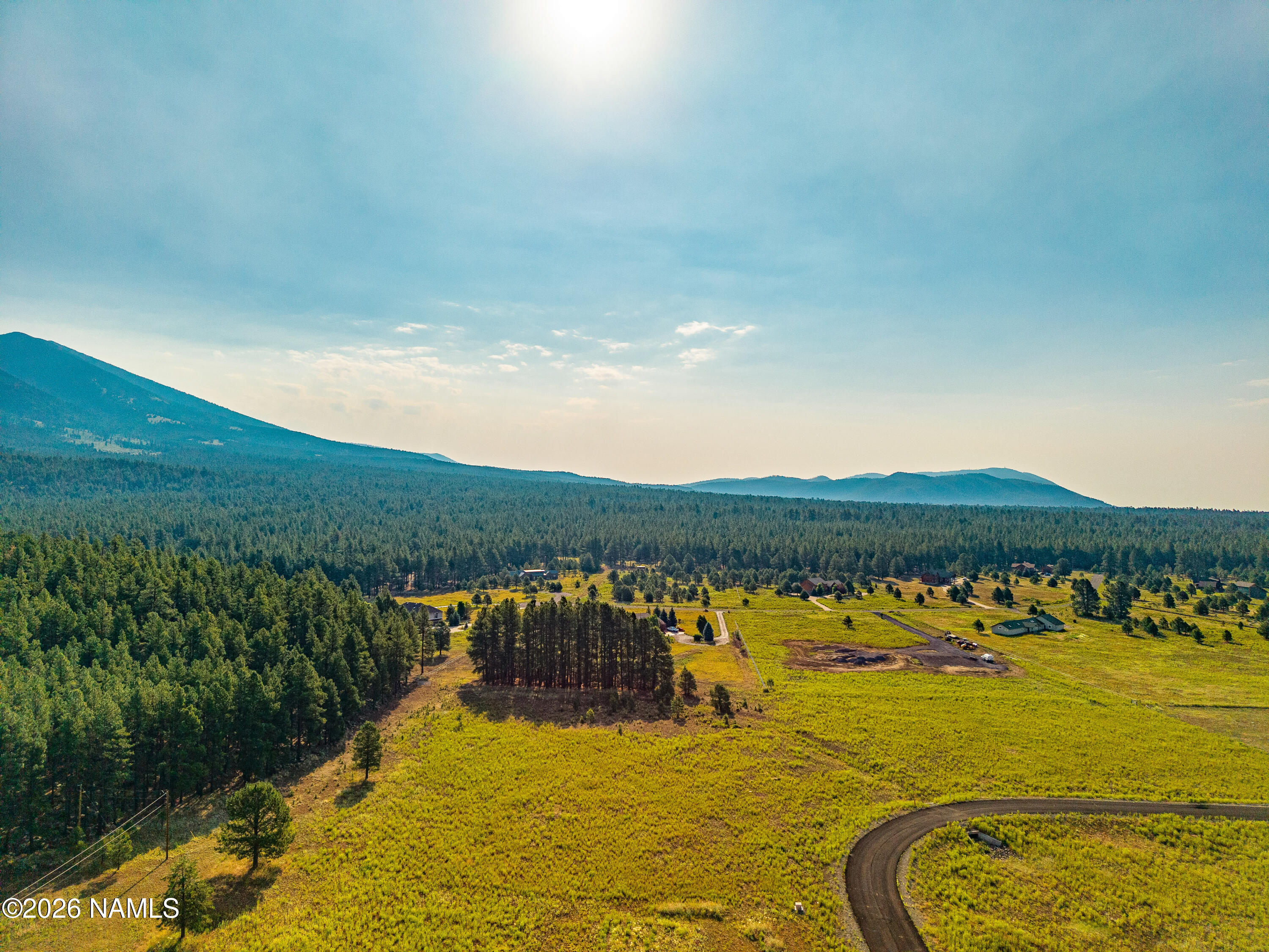 9217 Ranch At The Peaks Way Flagstaff, AZ 86001 - Photo 5 of 12 a view of a lake with houses in the back