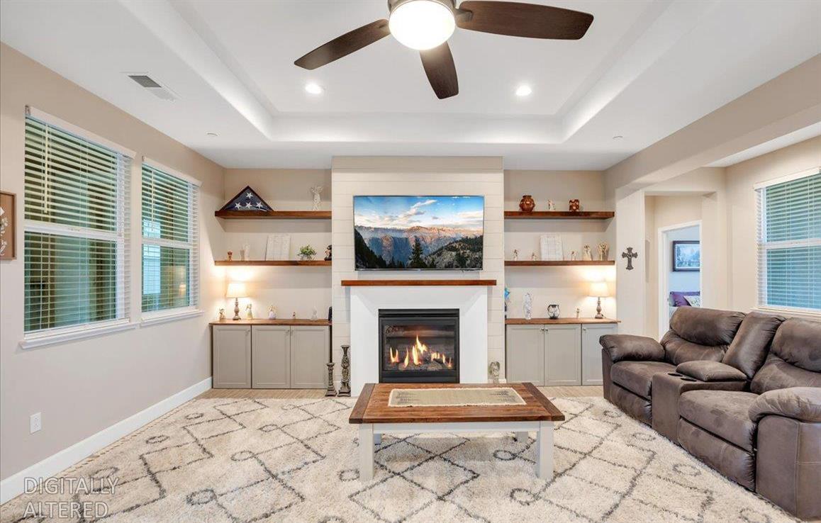 133 Palisades Place Copperopolis, CA 95228 - Photo 12 of 95 a living room with furniture a flat screen tv and a fireplace