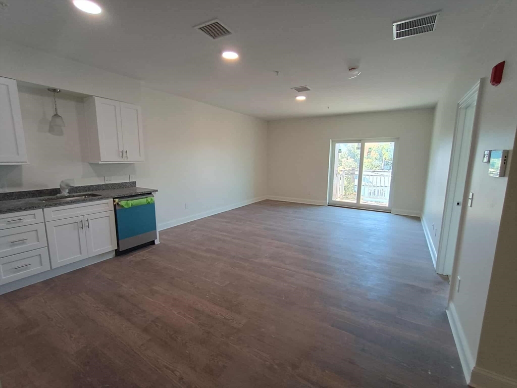 10 Franklin Avenue, Unit 402 Revere, MA 02151 - Photo 1 of 15 a view of a kitchen with dishwasher and a refrigerator