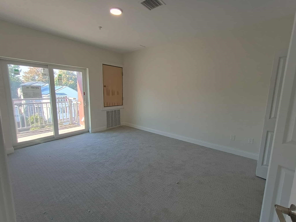 10 Franklin Avenue, Unit 402 Revere, MA 02151 - Photo 6 of 15 an empty room with windows