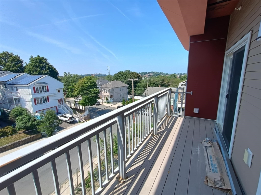10 Franklin Avenue, Unit 402 Revere, MA 02151 - Photo 9 of 15 a view of balcony with wooden floor and fence