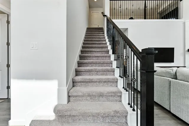 a living room with couches and a flat screen tv