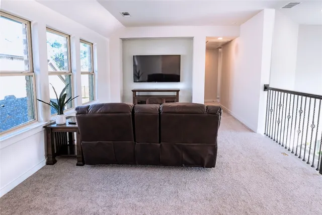 a living room with furniture and windows