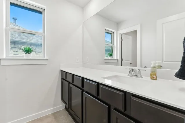 a view of an empty room with a ceiling fan