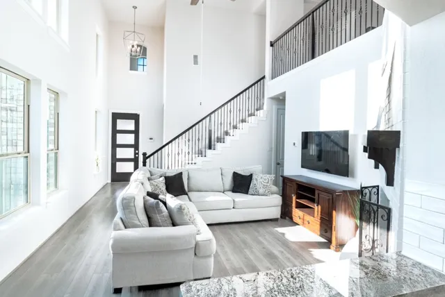 a living room with furniture and a flat screen tv