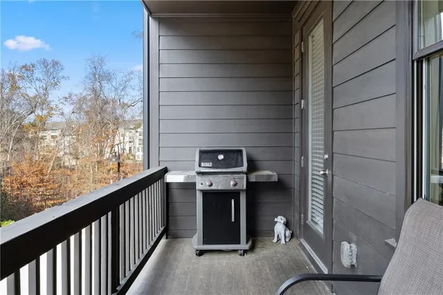 a kitchen with stainless steel appliances kitchen island granite countertop a stove a sink and a refrigerator