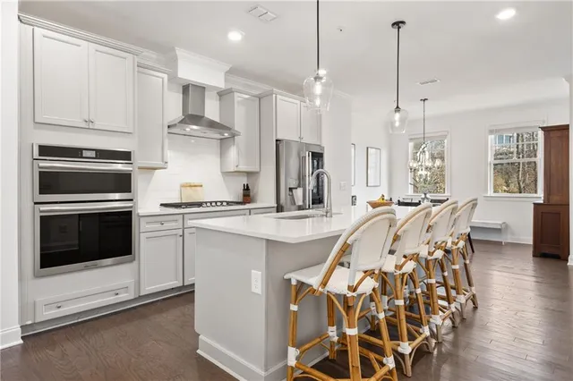 a dining room with furniture and wooden floor