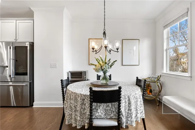 a bathroom with a sink toilet and a window