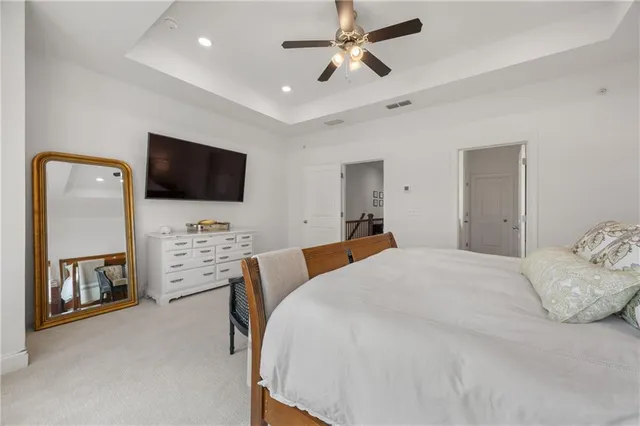 a en suite bathroom with a double vanity sink a large mirror and shower