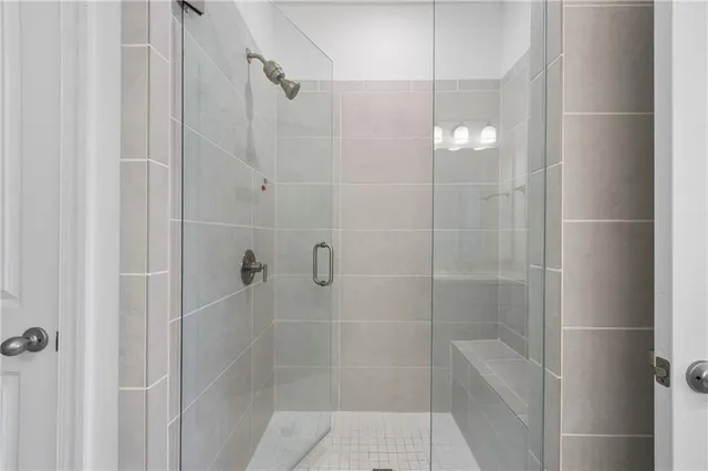 a view of a hallway with closet and utility room