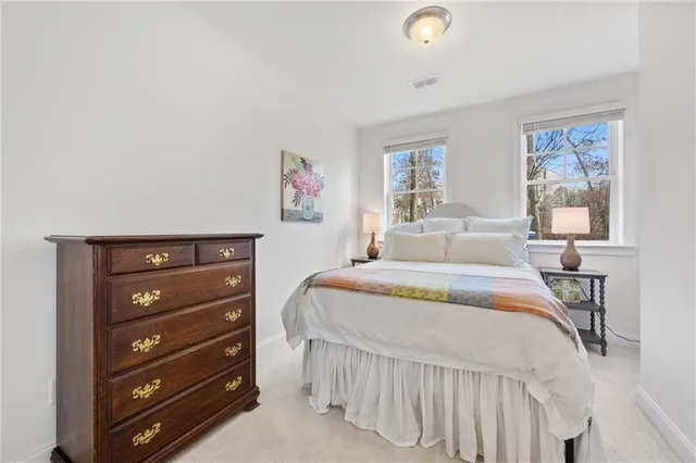 a picture of a bathroom with mirror and door