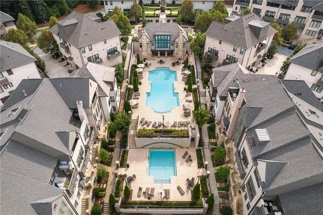 a room with furniture a rug and a flat screen tv