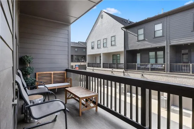 a kitchen with counter top space appliances and a ceiling fan