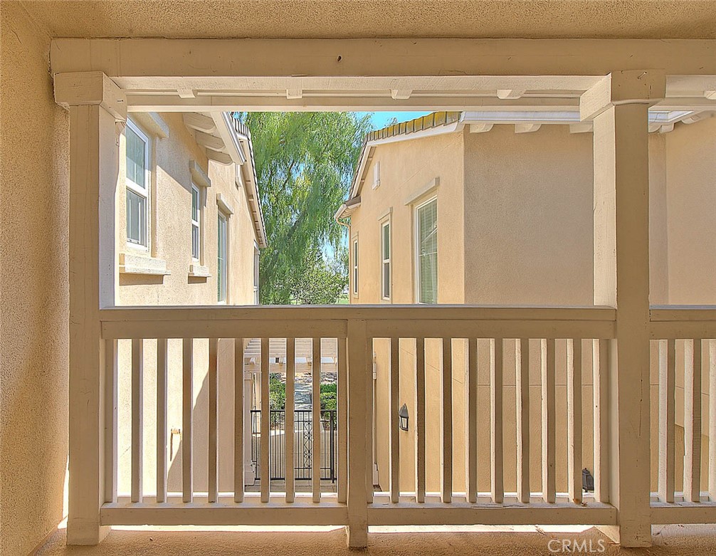 8150 West Preserve Loop Chino, CA 91708 - Photo 11 of 51 a view of a glass door with a small yard