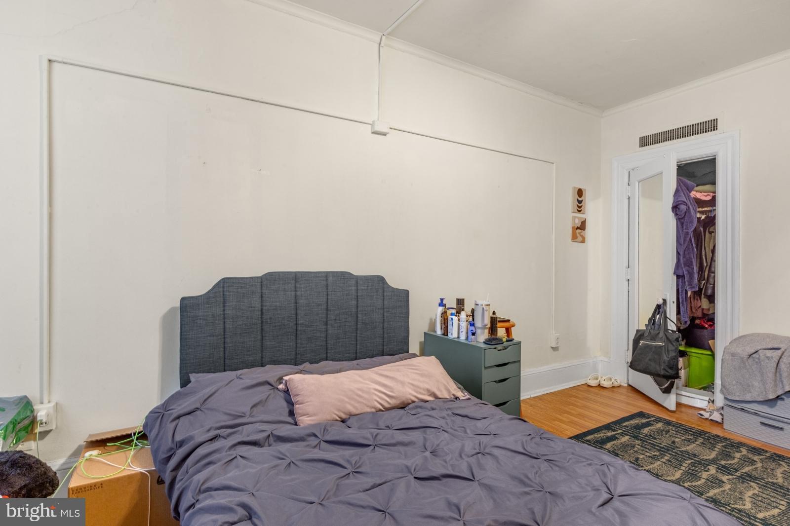 1324 Locust Street, Unit 1503 Philadelphia, PA 19107 - Photo 14 of 38 a bedroom with a bed and a window