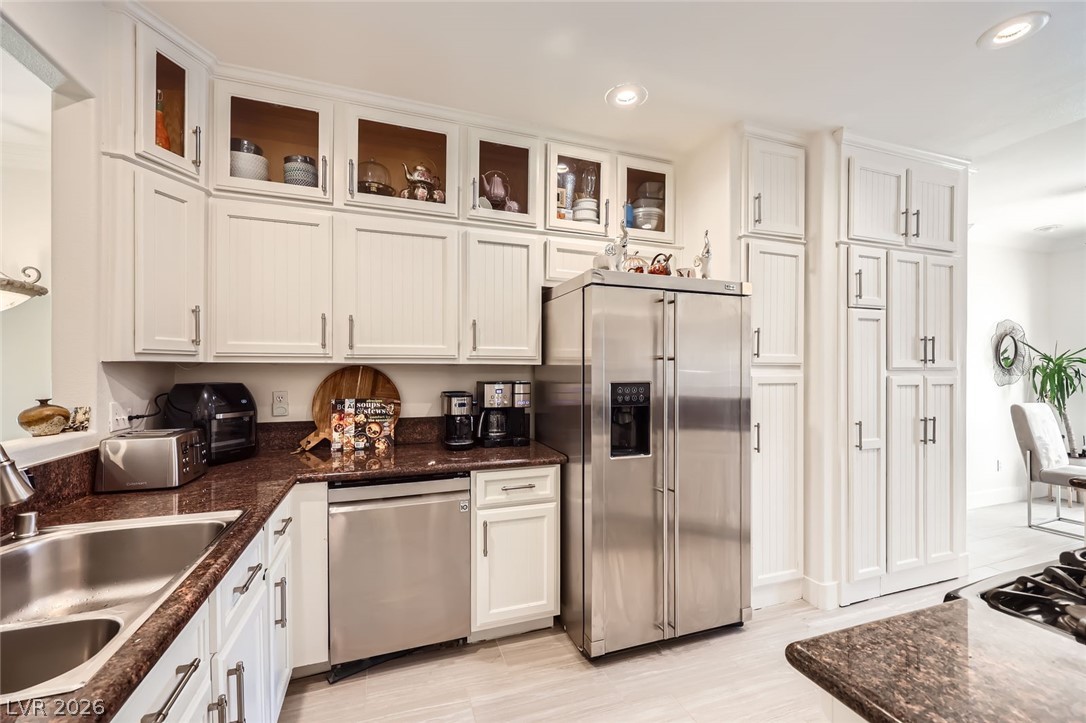 2050 West Warm Springs Road, Unit 3624 Henderson, NV 89014 - Photo 11 of 40 Kitchen with appliances with stainless steel finishes, white cabinetry, recessed lighting, and dark stone countertops