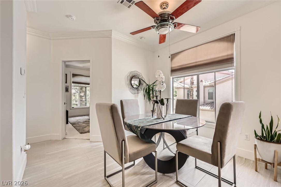 2050 West Warm Springs Road, Unit 3624 Henderson, NV 89014 - Photo 14 of 40 Dining area featuring plenty of natural light, a ceiling fan, and crown molding
