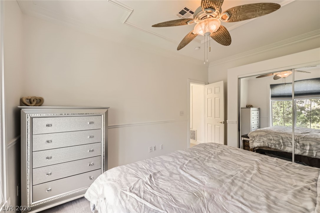 2050 West Warm Springs Road, Unit 3624 Henderson, NV 89014 - Photo 28 of 40 Bedroom featuring ornamental molding, ceiling fan, and a closet