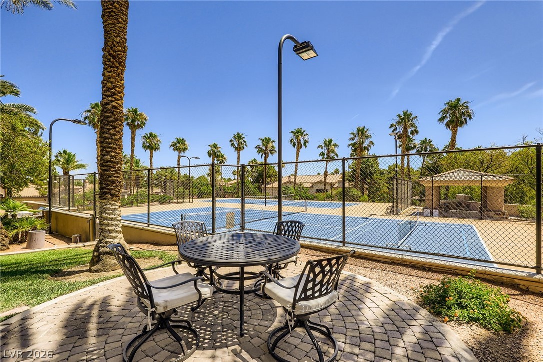 2050 West Warm Springs Road, Unit 3624 Henderson, NV 89014 - Photo 38 of 40 View of patio featuring a tennis court