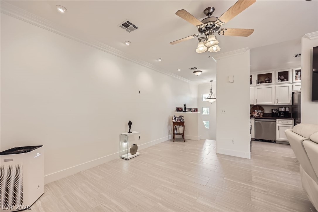 2050 West Warm Springs Road, Unit 3624 Henderson, NV 89014 - Photo 9 of 40 Living area with ornamental molding, ceiling fan, and recessed lighting