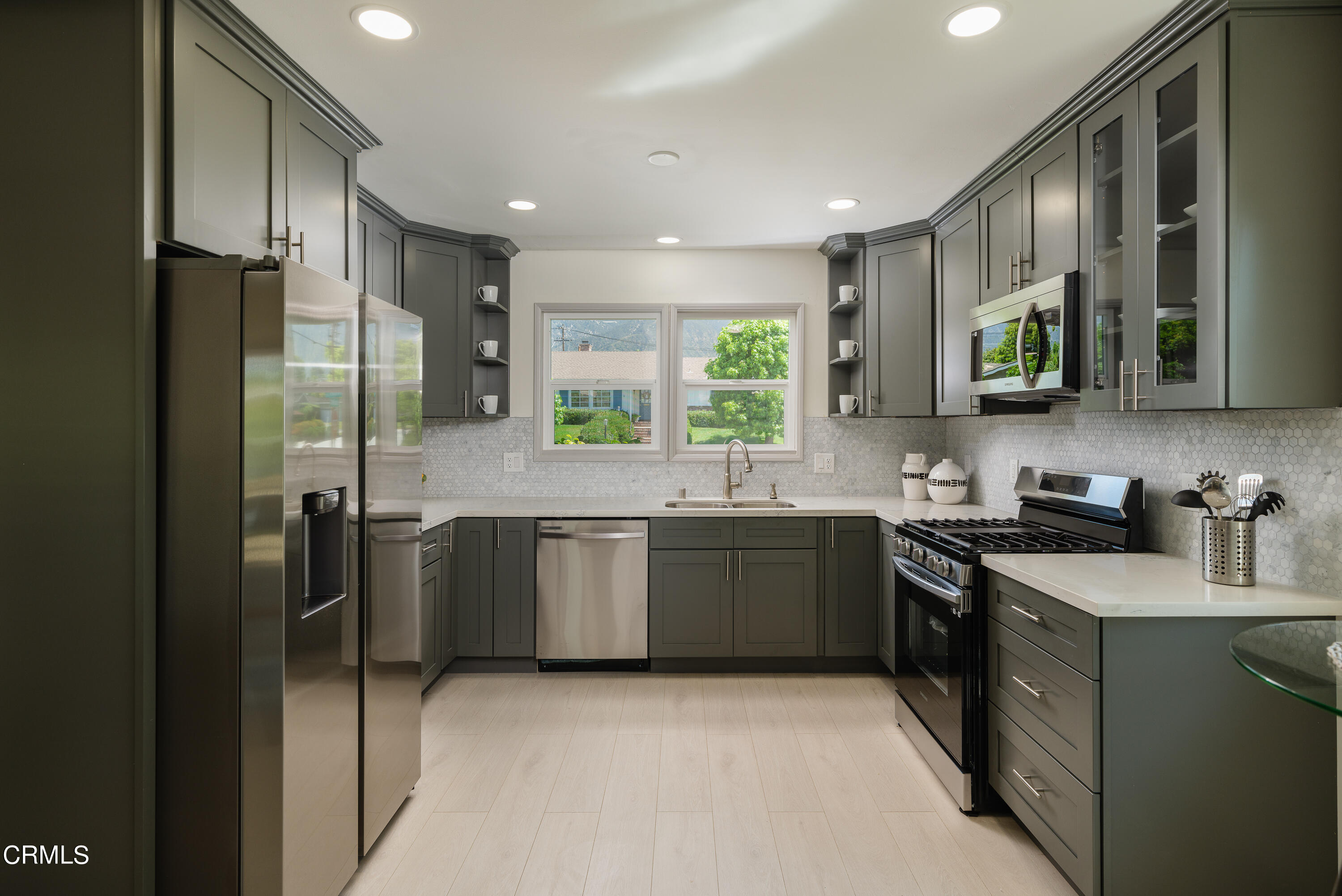 3720 Newhaven Road Pasadena, CA 91107 - Photo 10 of 37 a kitchen with stainless steel appliances granite countertop a refrigerator a sink a stove a washer dryer and a refrigerator