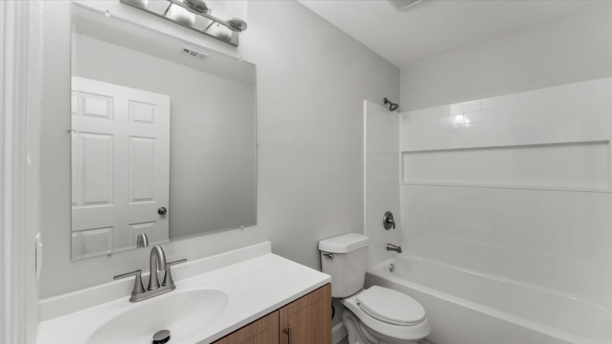 3123 Patience Avenue Houston, TX 77014 - Photo 11 of 22 a bathroom with a sink toilet and shower