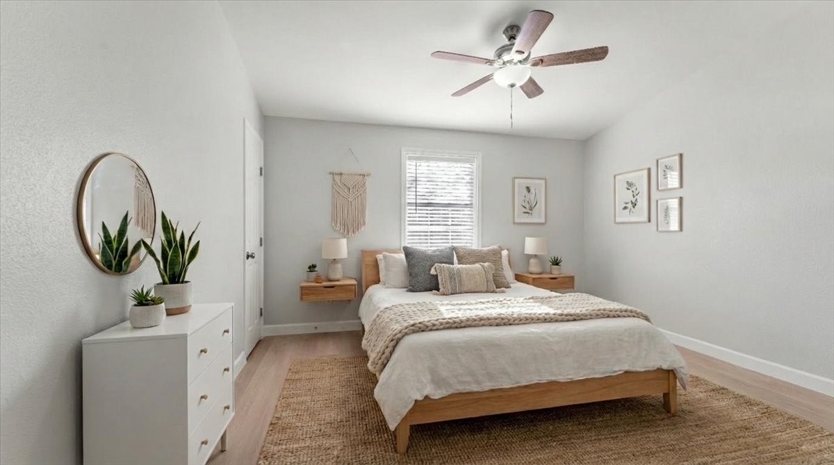 3123 Patience Avenue Houston, TX 77014 - Photo 14 of 22 a bedroom with a bed and a chandelier