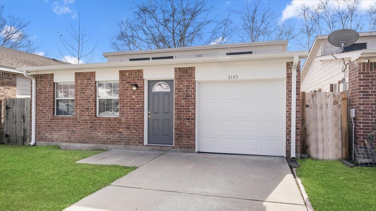 3123 Patience Avenue Houston, TX 77014 - Photo 2 of 22 a view of a brick house with a large window