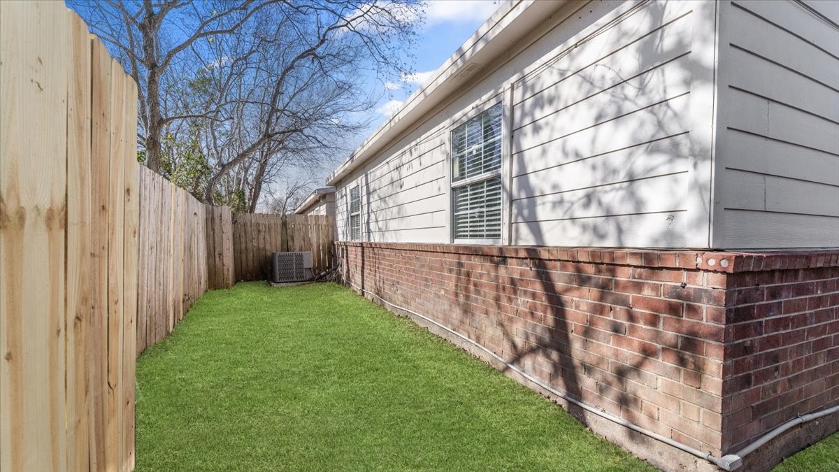 3123 Patience Avenue Houston, TX 77014 - Photo 21 of 22 a view of a backyard with plants and large trees