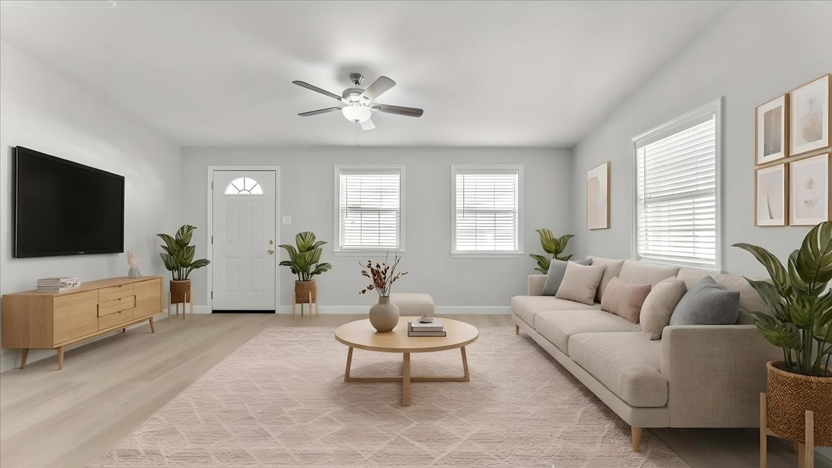3123 Patience Avenue Houston, TX 77014 - Photo 5 of 22 a living room with furniture a window and a flat screen tv
